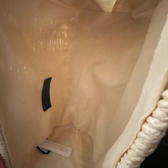 Ann Taylor straw woven clutch with gold accents. Fold over toggle closure. - Picture 6 of 12